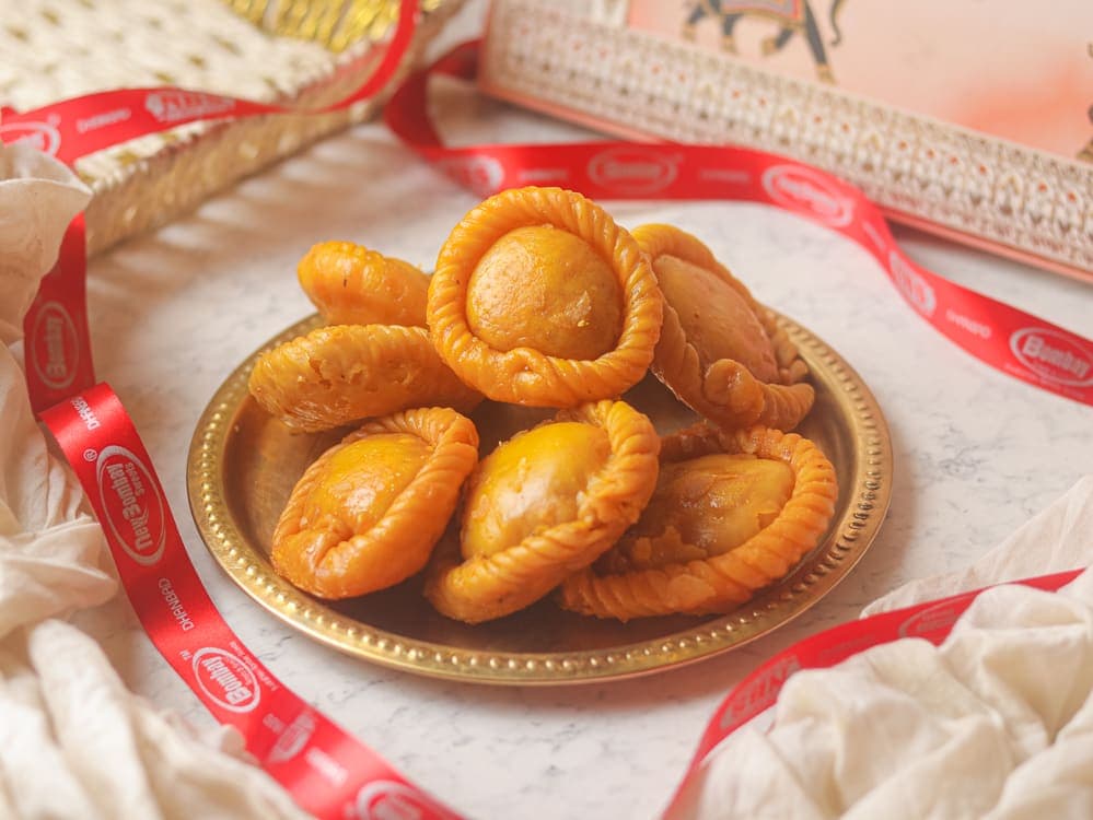 Chandrakala — khoya & dry-fruit parcels in syrup